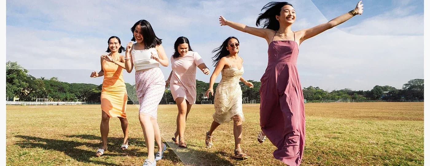 Five friends running across an open field with their arms out under the line “Overload less. Live more.” — the launch campaign for Nexus, a personal AI assistant