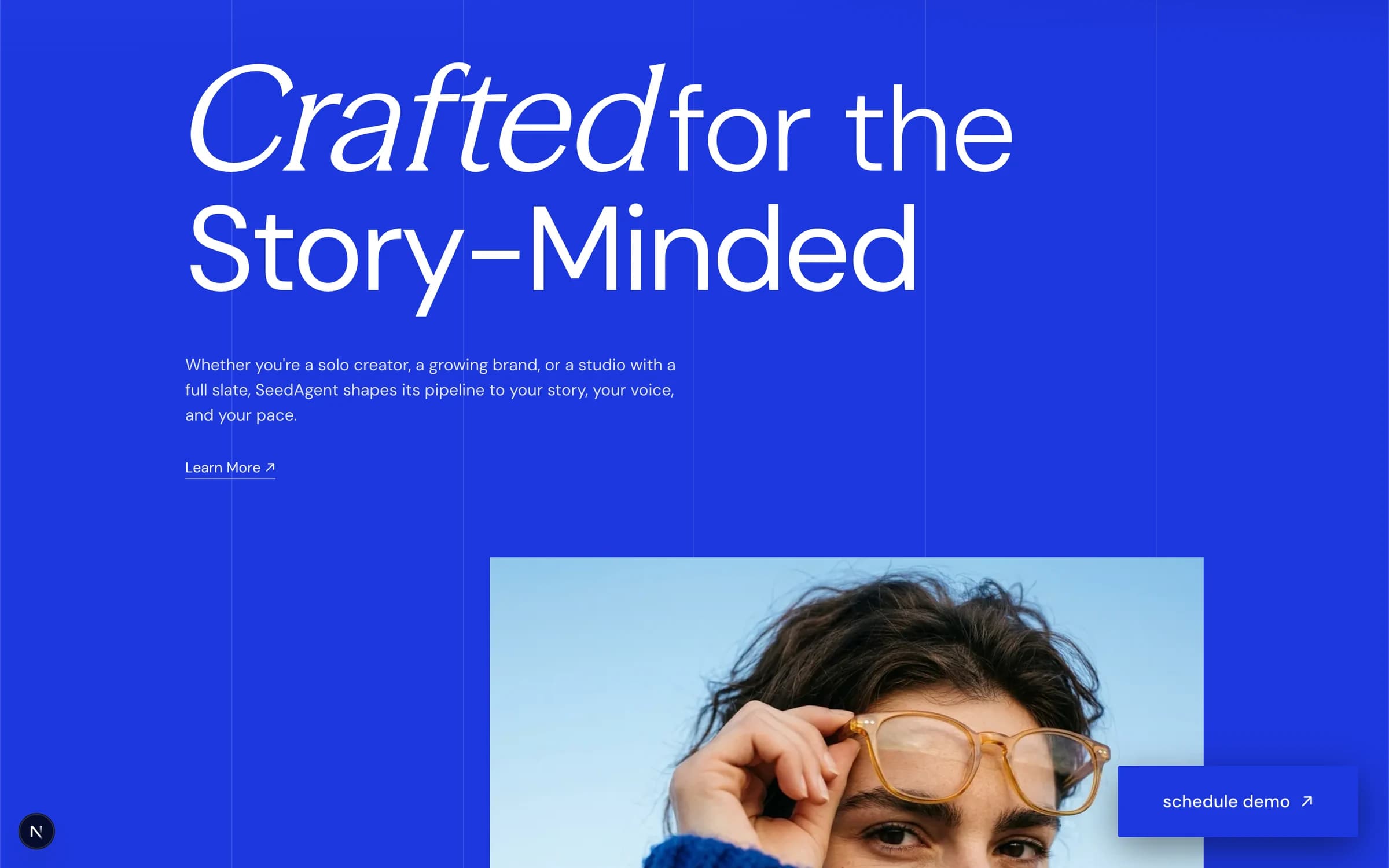 The /01 panel: a full blue field carrying the line “Crafted for the Story-Minded” beside a portrait