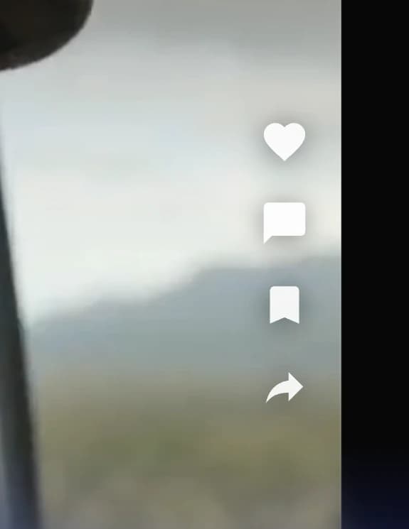 The feed rail inside the right edge of the window: heart, comment, bookmark and share