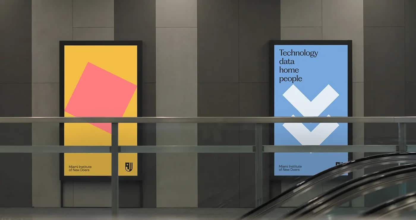 Backlit programme posters in a concrete transit concourse beside an escalator.