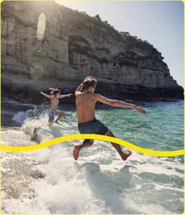 Campaign image: jumping into the sea below a cliff