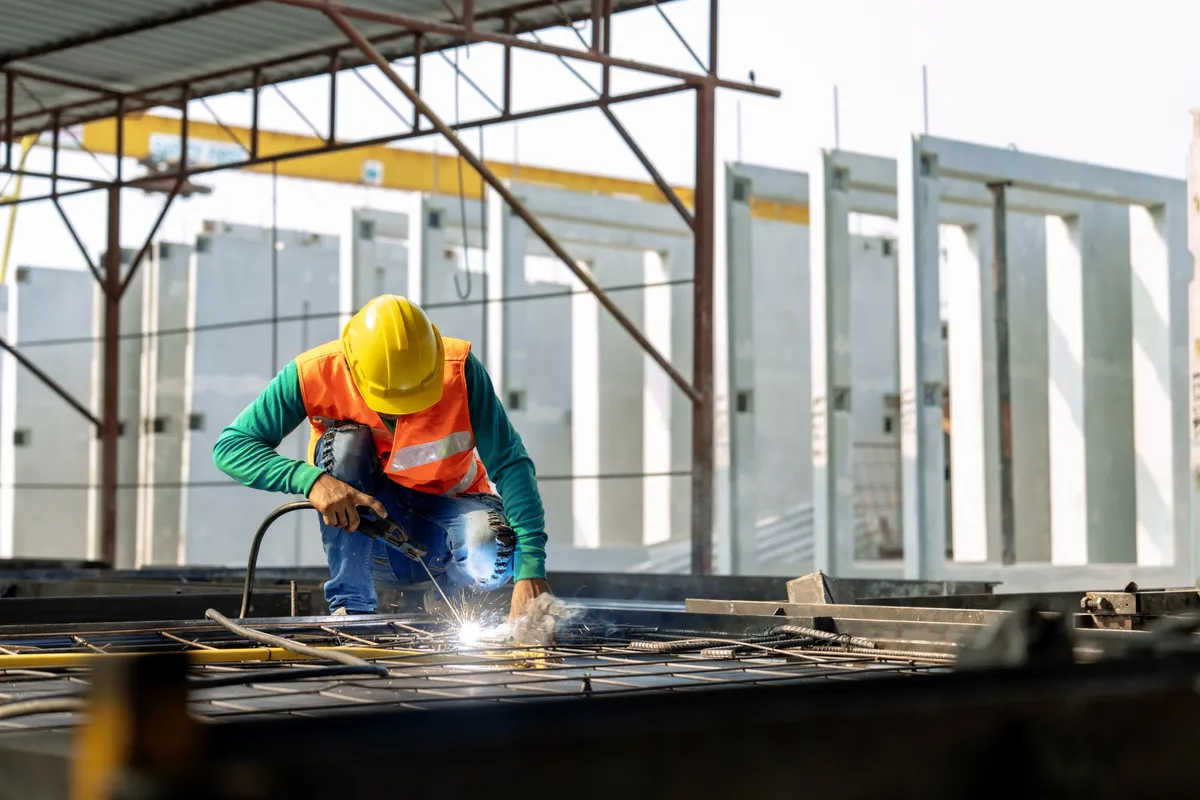 A construction crew working on a timber frame