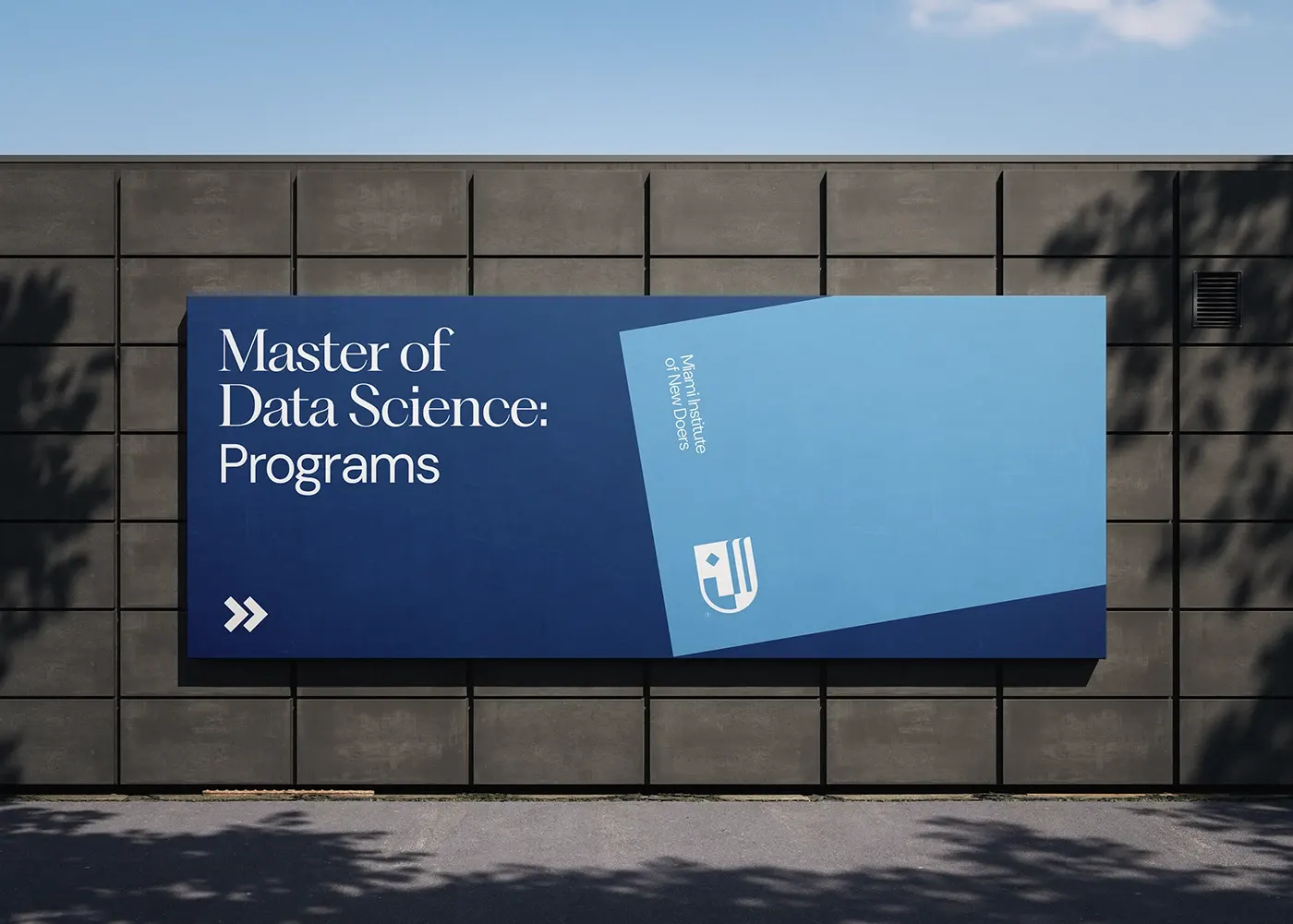 A navy and pale-blue billboard for a Master of Data Science programme on a concrete wall.